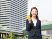 Japanese business woman holding a smart phone