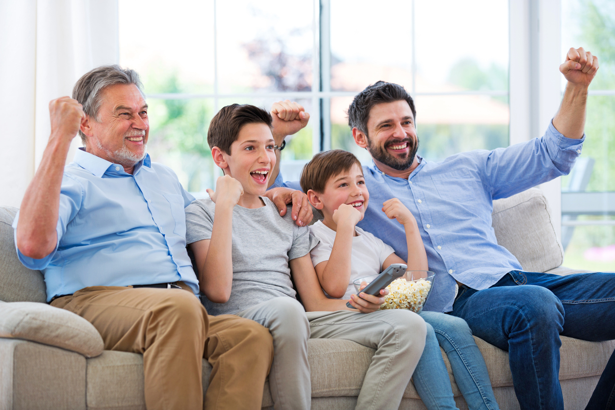 Family watching football match on telly