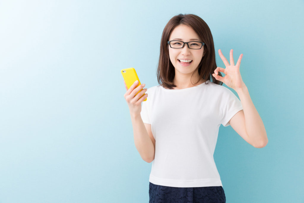 Japanese woman holding a smartphone