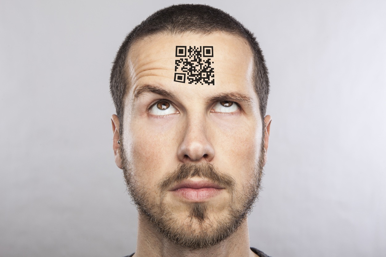 young man with a qr code on his forehead
