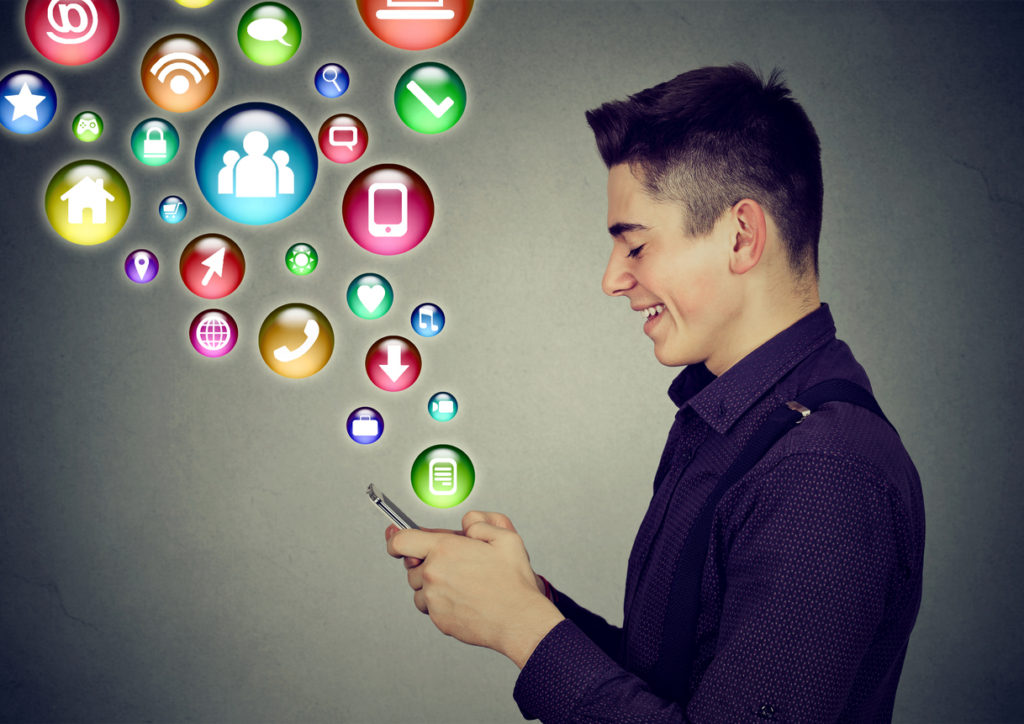 man using smartphone with social media application icons