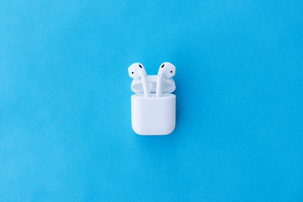ROSTOV-ON-DON, RUSSIA - APRIL 28, 2018: Apple AirPods wireless Bluetooth headphones and charging case for  Apple iPhone. New Apple Earpods Airpods in box.
