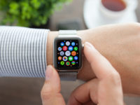 Man hand with Apple Watch and app Icon on screen