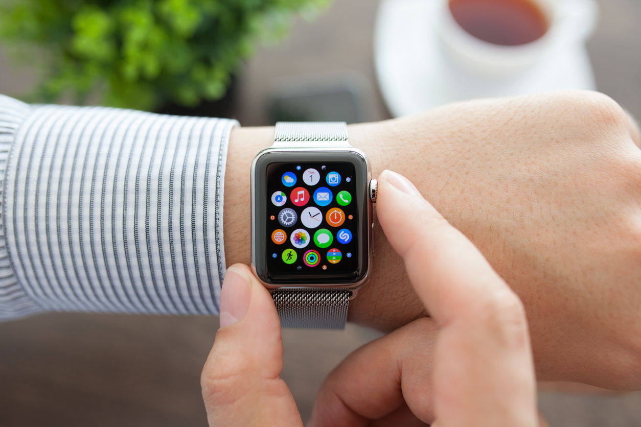 Man hand with Apple Watch and app Icon on screen