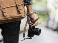 Photographer with leather bag in the city