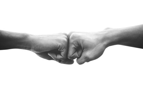 Hands of man people fist bump team teamwork and partnership business success, Black and white image
