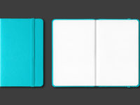 Aqua blue closed and open notebooks isolated on black