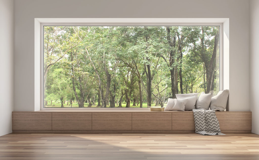 Side window seat 3d render.There are white room,wood seat,decorate with many pillow.There are big  windows look out to see nature view.
